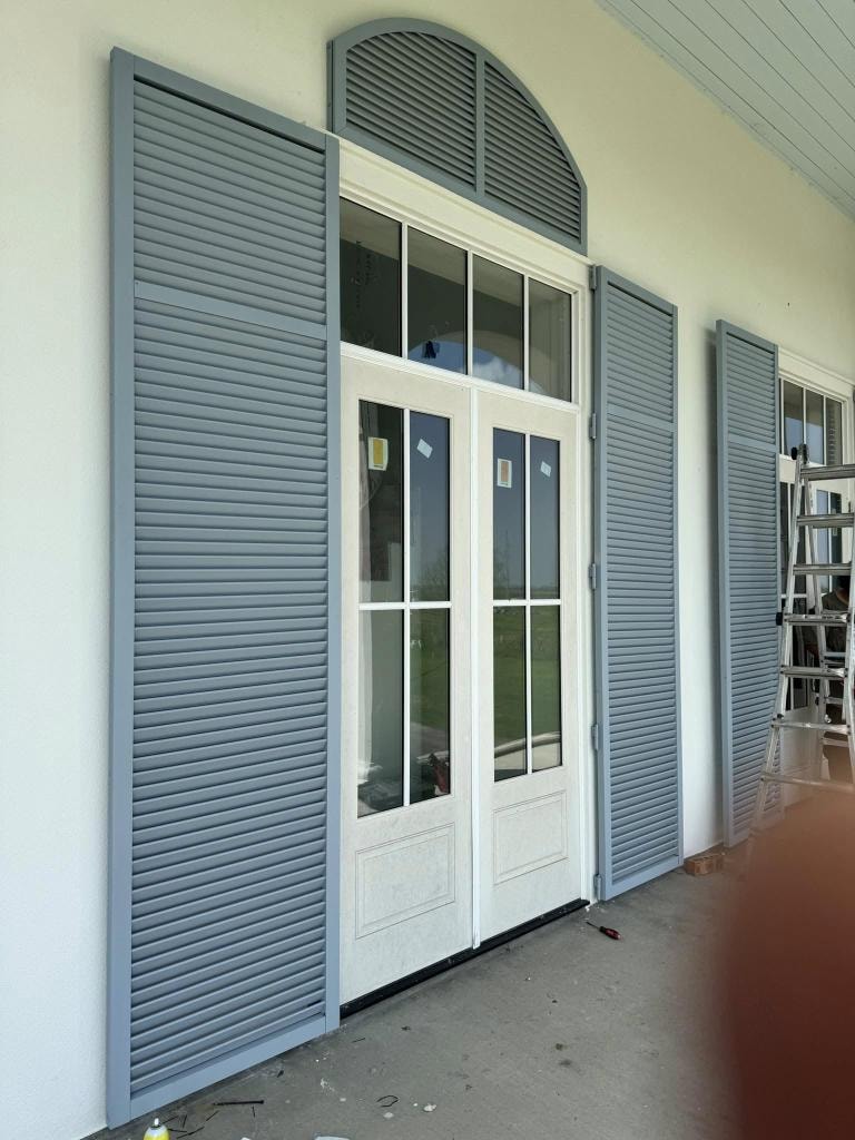 Hurricane shutters installed on home exterior