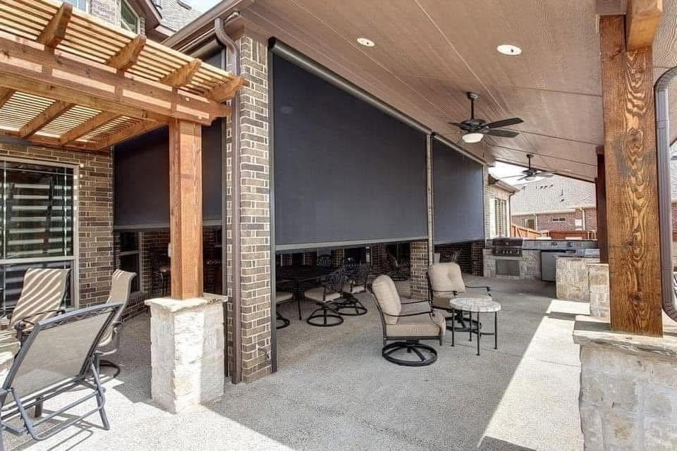 Motorized retractable patio screen on outdoor living area